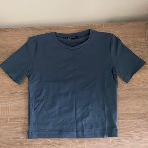 dark blue/grey tight t shirt cute with anything v flattering on bigger chests